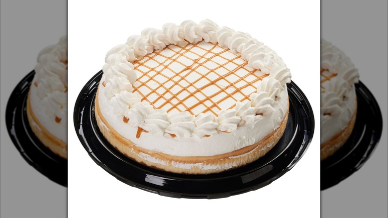 Whole Kirkland Signature Salted Caramel Cheesecake on black tray