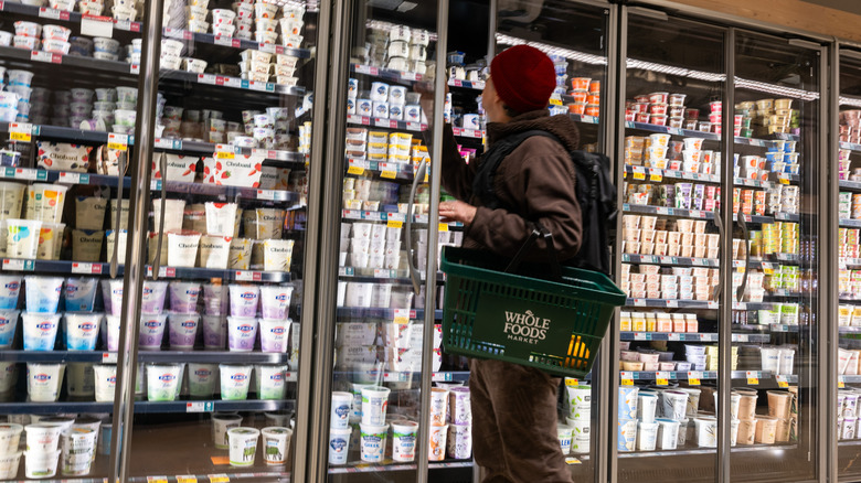 Man shops for yogurt at Whole Foods