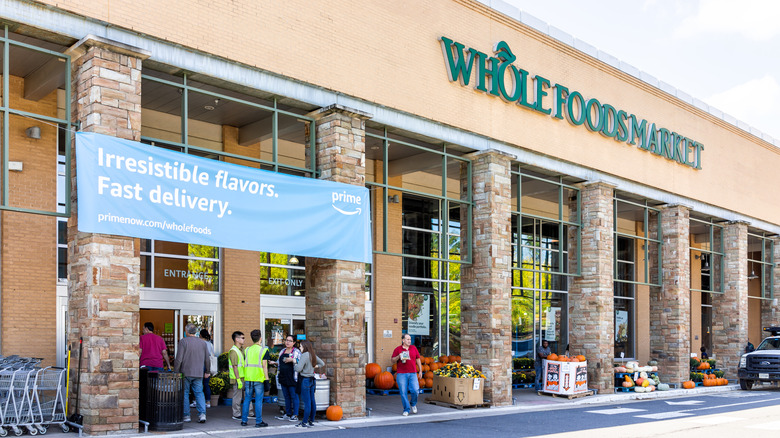 Whole Foods storefront with large Amazon Prime banner