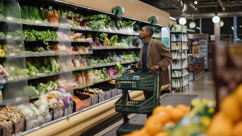 Man browsing through produce section