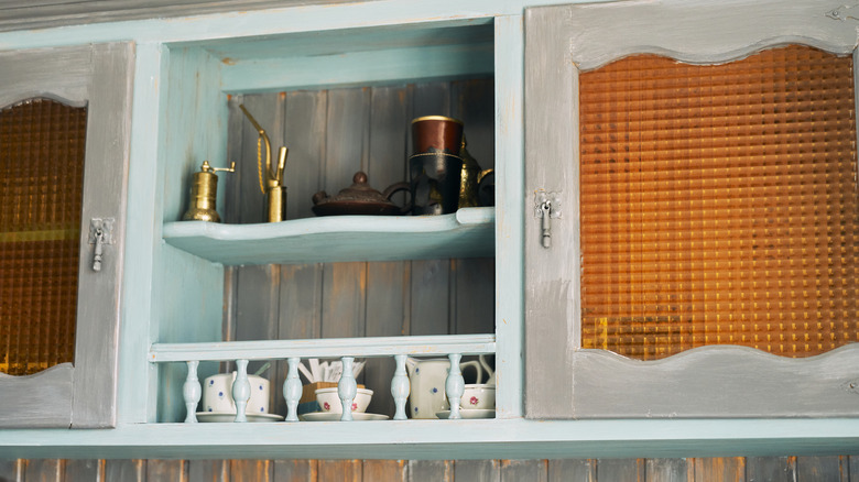 Shelves and cabinets storing decor in kitchen