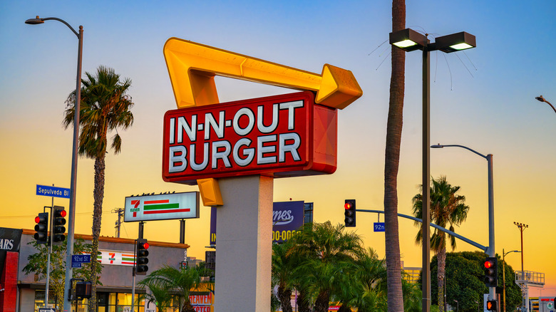 In-N-Out Burger sign on a street corner in Los Angeles, California at sunset