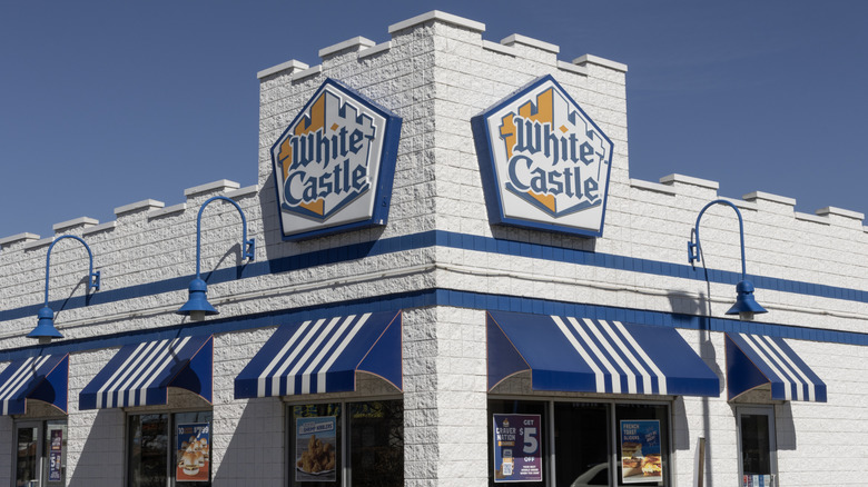 White Castle Hamburger fast food restaurant front against blue sky
