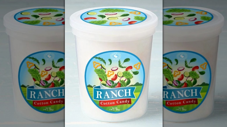 tub of ranch cotton candy on blue background, mirrored image