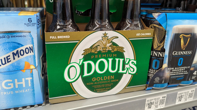 different types of non alcoholic beer on store shelf