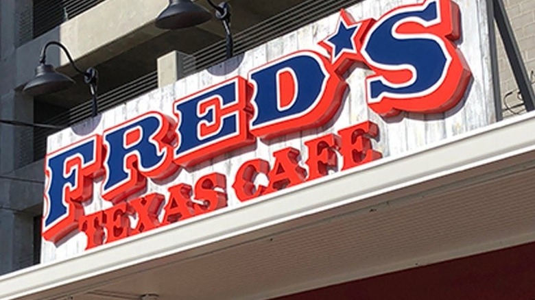 Fred's Texas Cafe sign with two black lights