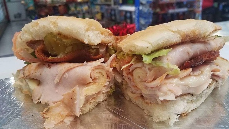 A loaded ham sandwich cut in half
