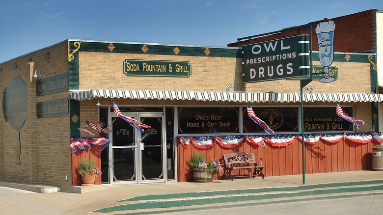 Brick building with "Soda Fountain & Grill" sign