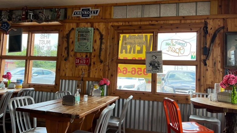 Inside of a restaurant with wooden tables