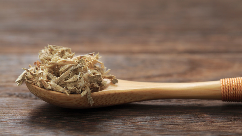 wooden spoon with dried marshmallow root