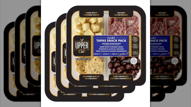 Thee Upper Cut Curated Tapas Snack Packs with salami, cheese, crackers, and chocolate cranberries