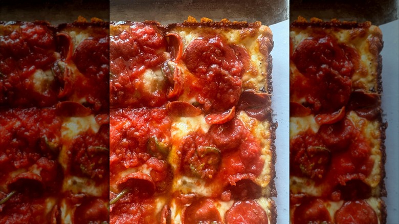 Corner of Detroit-style pizza with pepperoni