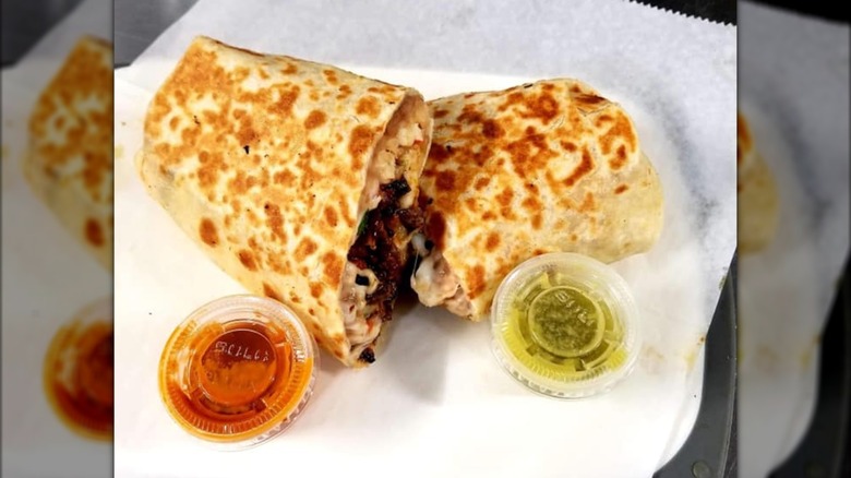 Carne asada burrito with red and green salsa