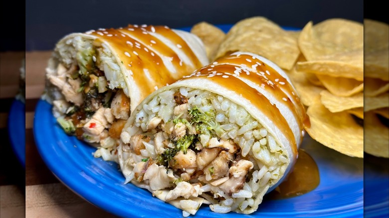 Burrito with chicken, broccoli, and rice with chips