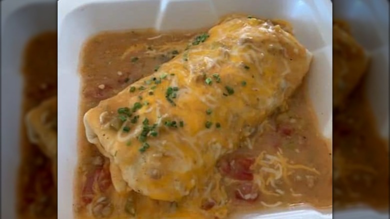 Smothered burrito in styrofoam container