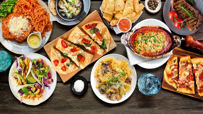 Various foods spread on a wooden table
