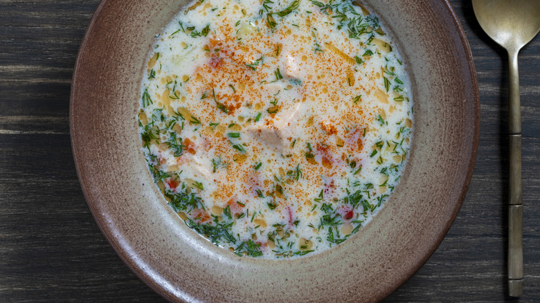 Smoked salmon chowder in a brown bowl