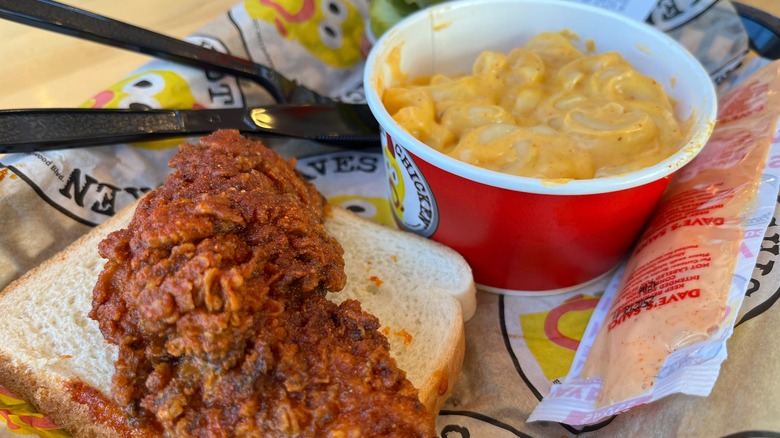 Dave's Hot Chicken meal with chicken, bread, and mac and cheese