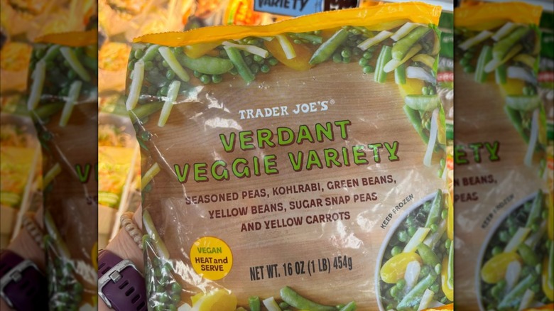 Customer holds frozen veggies package