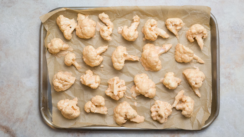 battered cauliflower on baking pan