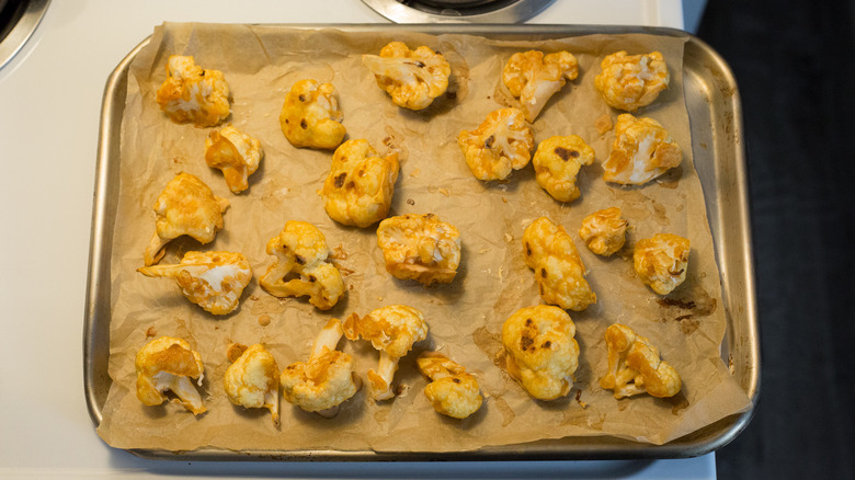 Baked cauliflower on baking pan