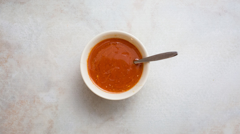 Buffalo sauce in small bowl