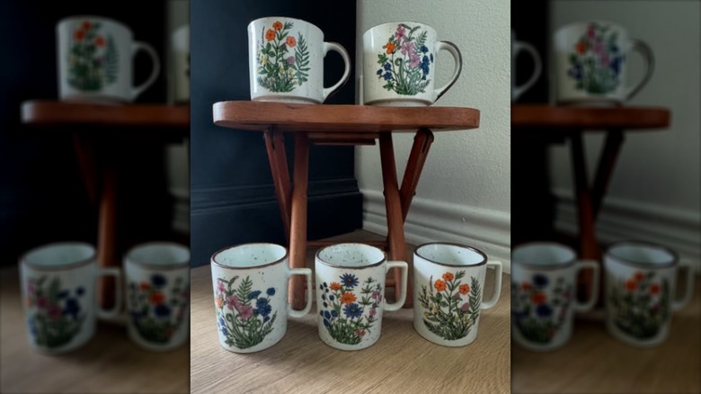 Vintage, floral Otagiri mugs on a wooden display