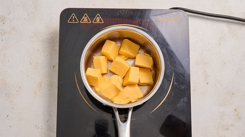 Cubed Velveeta in saucepan