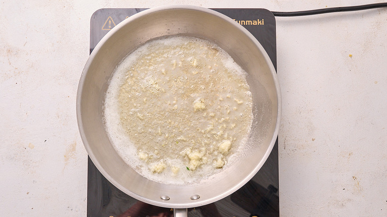 cooking garlic in a skillet