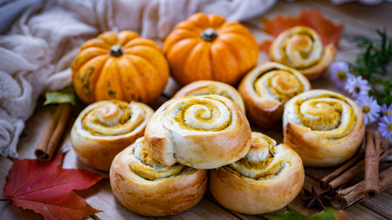 freshly baked cinnamon rolls with pumpkins