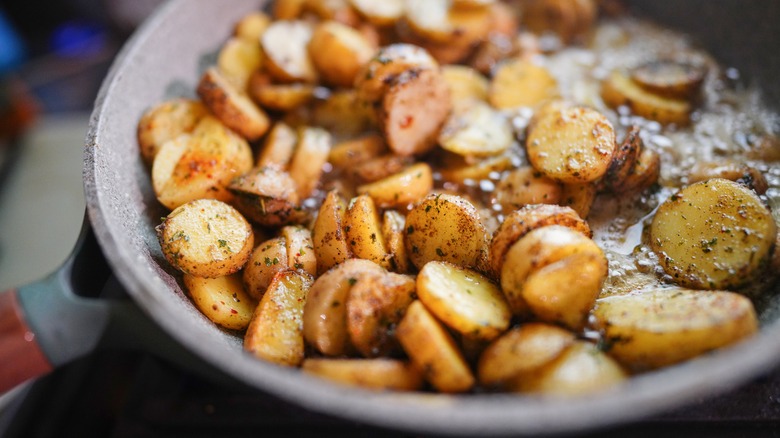 Small potatoes sliced into disks and pan-fried in a skillet
