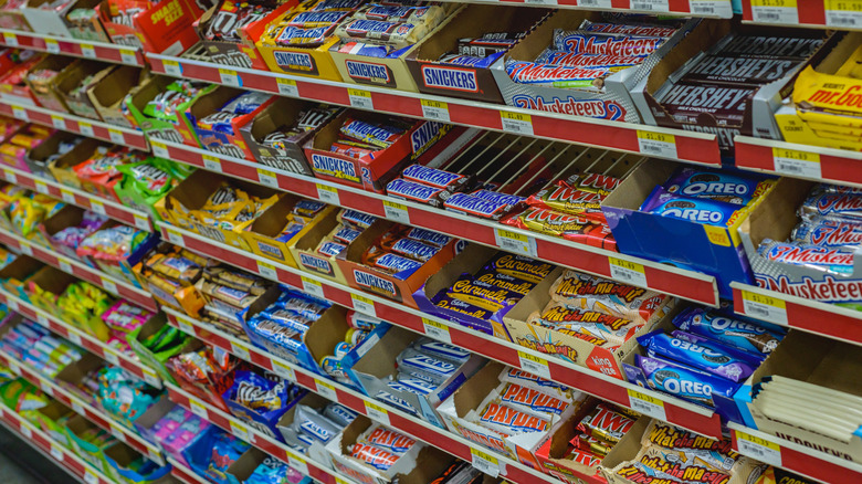 Candy bars in a grocery store aisle