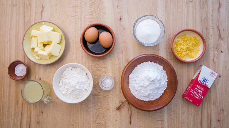 flour, sugar, butter, eggs, and other lemonade cookie ingredients on table