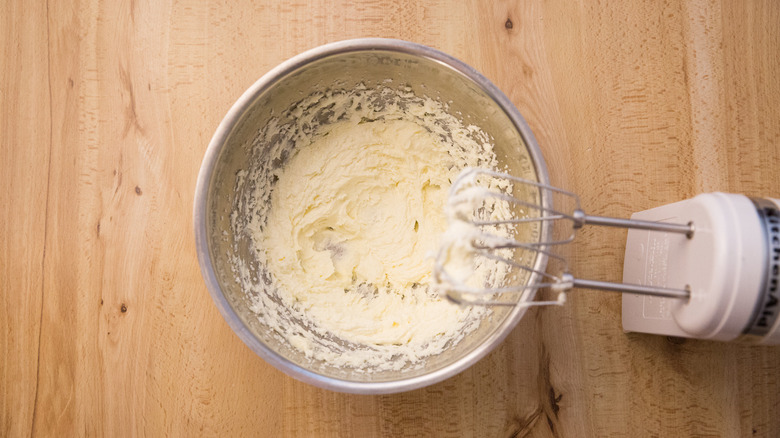 cookie batter in mixing bowl next to standing electric mixer