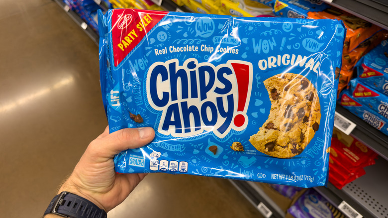 Customer holding a package of Chips Ahoy! cookies