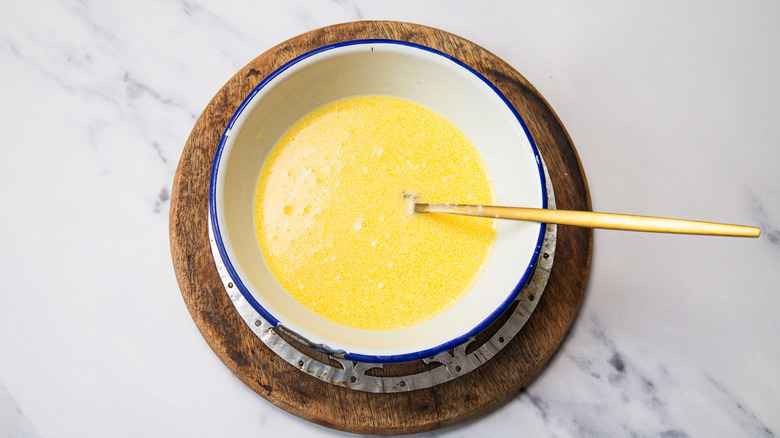 Wet ingredients in a small bowl with fork.