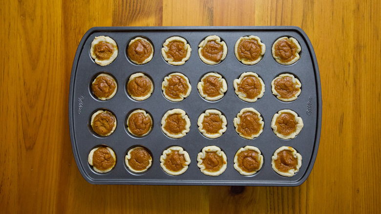 mini pumpkin pies in pan
