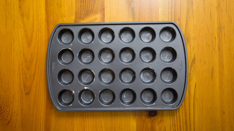greased mini muffin tin