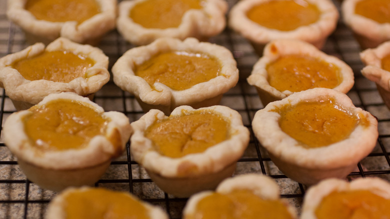Bite-size pumpkin pies on a cooling rack