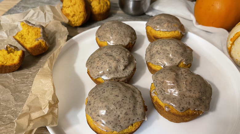 iced pumpkin muffin donuts on plate