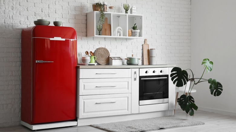 White kitchen with bright red refrigerator