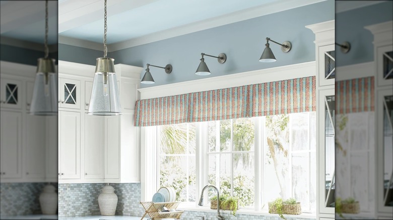 Kitchen with pale blue walls and ceiling