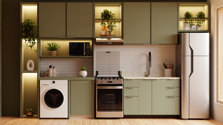 Sage green and neutral colored kitchen