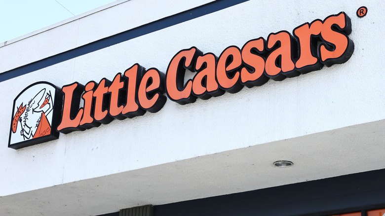 Little Caesars sign on beige building
