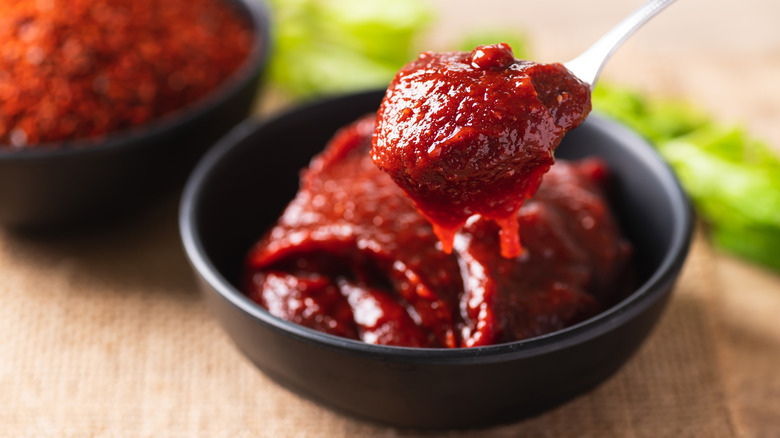 Red gochujang paste in a bowl.