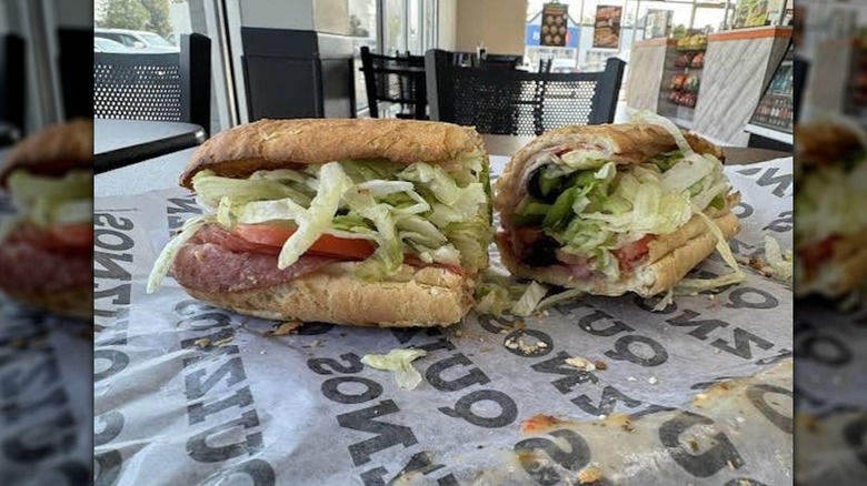 Quiznos sub on a paper wrapper