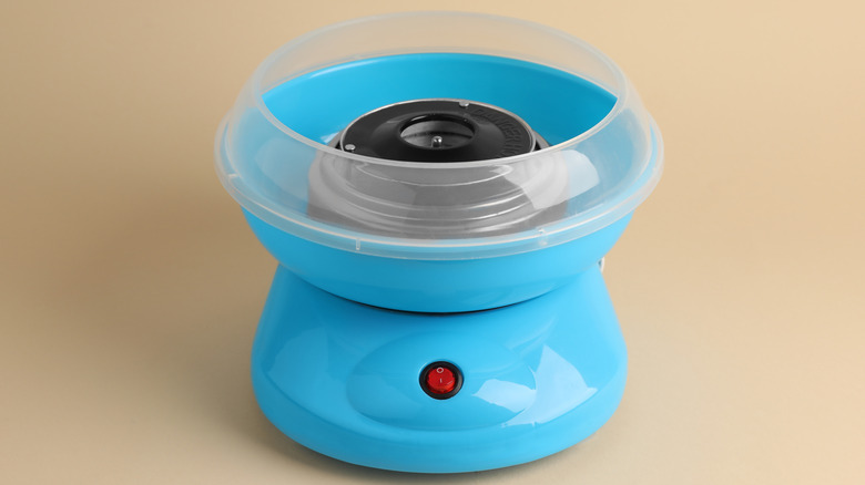 small blue cotton candy maker