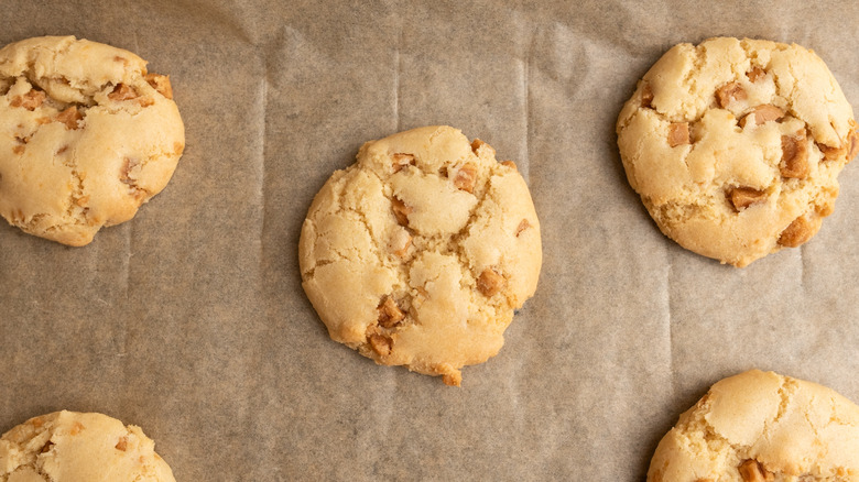 baked soft caramel cookies arranged on parchment paper