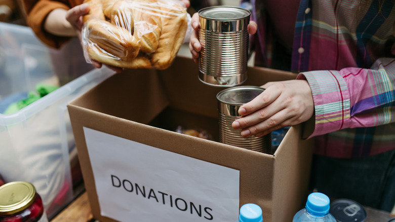 People pack a food donation box