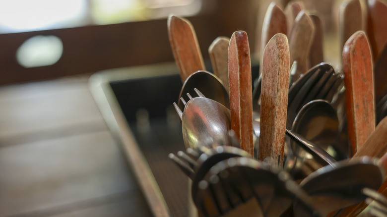 Close-up of kitchen utensils in drying rack